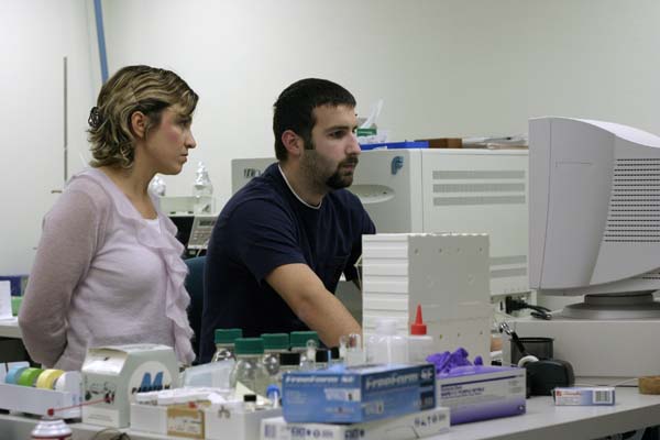 two people working together at a computer