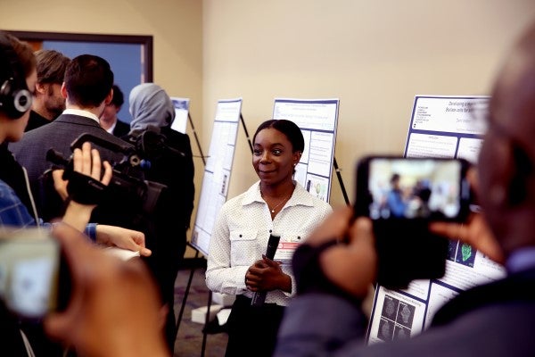 UIC student Demi Ibrahim presents her poster at the Research Symposium