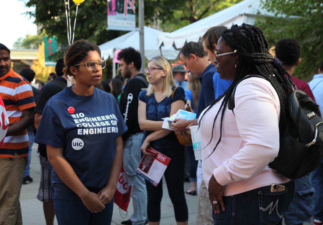 people chatting at a fair