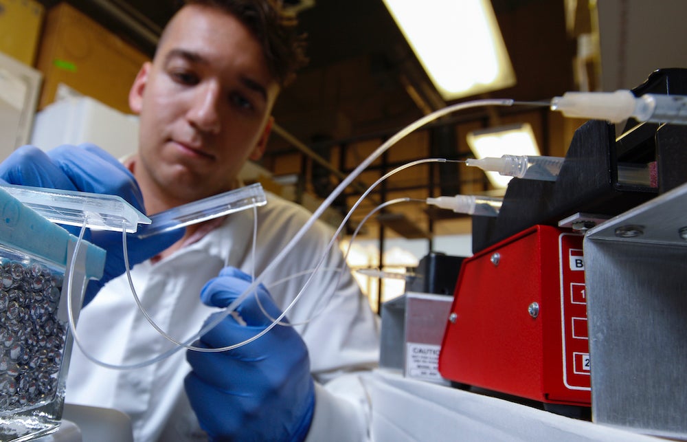 a UIC student in bioengineering at work in the Microfabricated Tissue Models (MTM) Lab