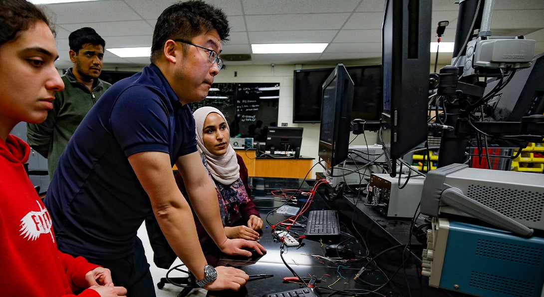 Teacher and Students on Computer