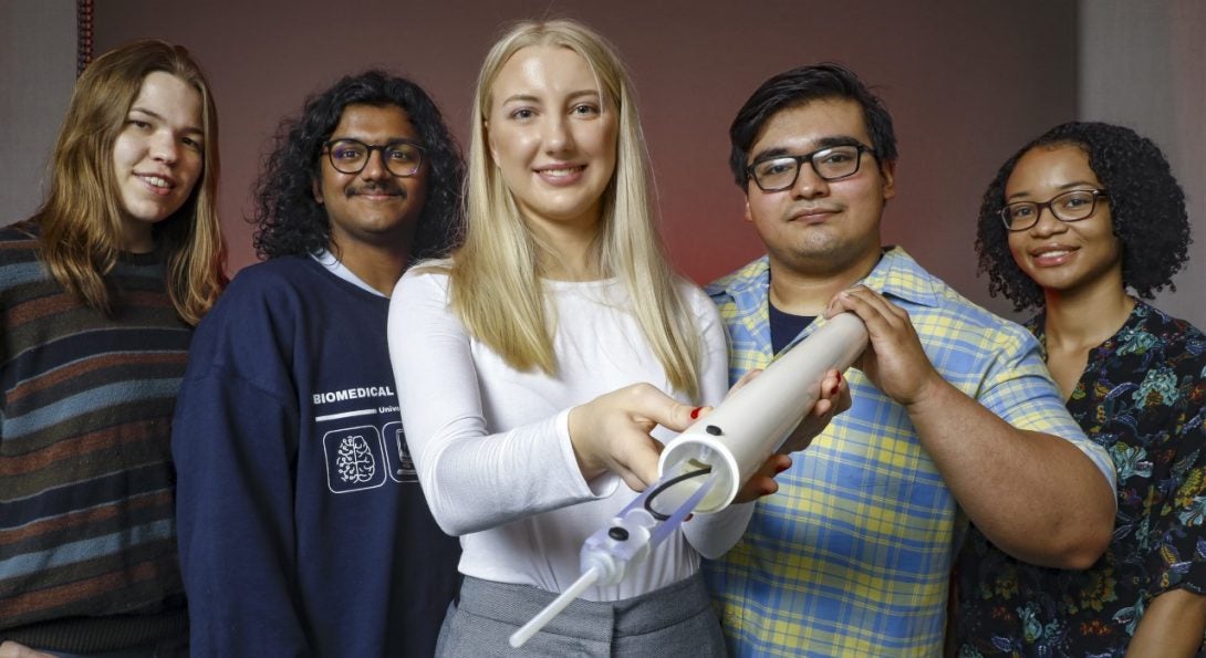 Senior Design Group poses with their medical device