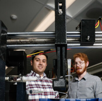 University of Illinois Chicago College of Engineering BME alumni Tommy Puttrich (L) and Stephen O'Donnell with a device to mix colloidal suspension.
                  
