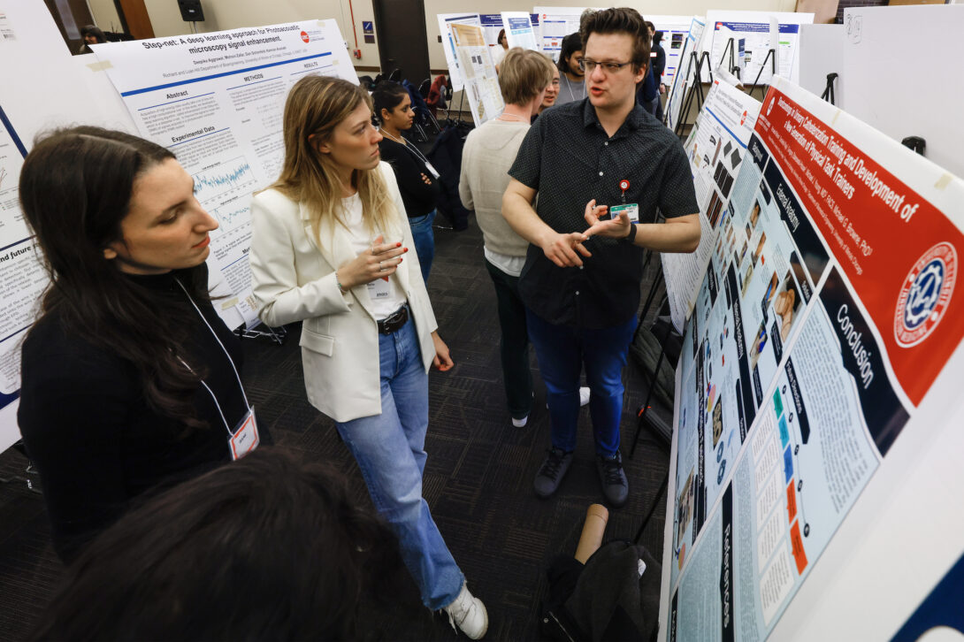 University of Illinois Chicago College of Engineering student explains their research during the poster session at the 5th Annual Biomedical Engineering Research Symposium and Industry Day.