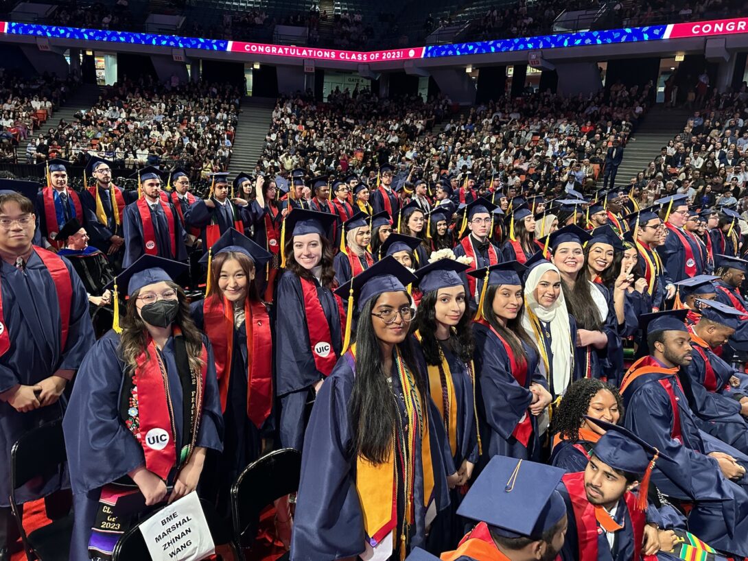 Chandhana Voleti (bottom center) stands with other graduates of the Richard and Loan Hill Department of Biomedical Engineering during the 2023 ceremony