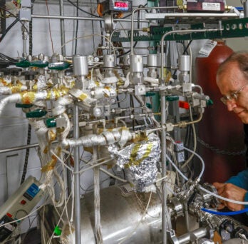 University of Illinois Chicago College of Engineering BME Professor Christos Takoudis with a custom built atomic layer deposition system in his lab.
                  