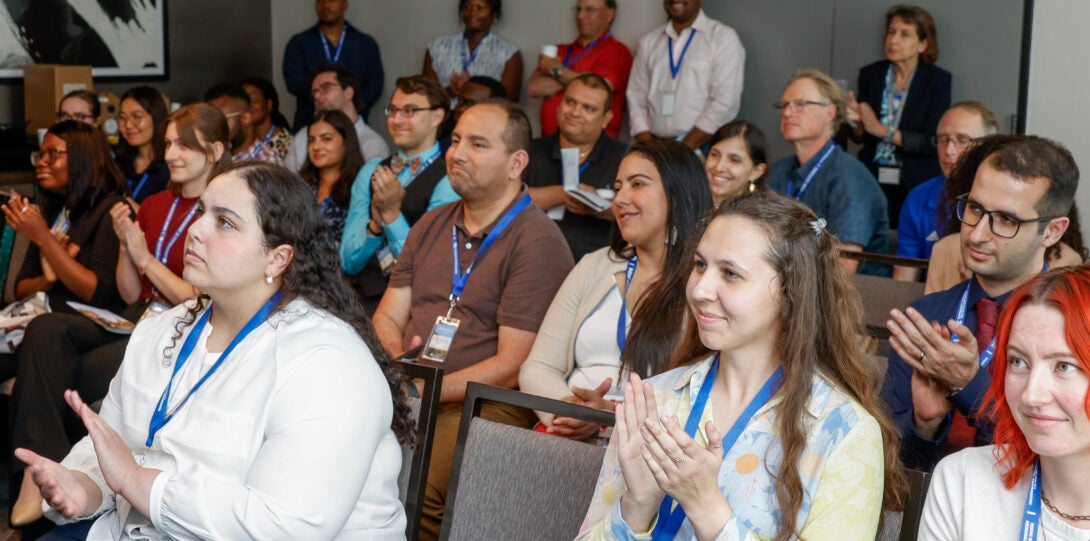 Attendees of the 2024 Rising BME Scholars Conference applaud after a presentation.