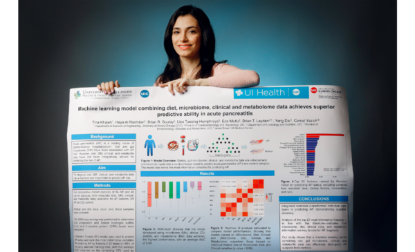 BME PhD student Tina Khajeh shows off her poster for the upcoming conference